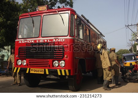 PONDICHERRY, INDIA - CIRCA 2011: Indian fire crews attend blaze in apartment
