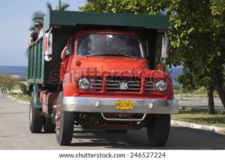 HAVANA, CUBA - CIRCA JANUARY 2014: 1960s vintage Bedford tipper truck carrying workers circa January 2014 near Havana