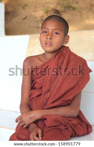 MRAUK U, MYANMAR - DECEMBER 12: An unidentified Burmese Buddhist novice on December 12, 2009 in Mandalay, Myanmar. In 2009 an ongoing conflict started between Buddhists and Muslims in Myanmar.