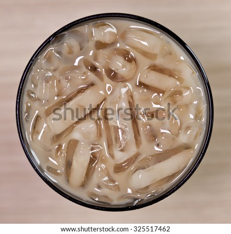 Iced tea with milk top view