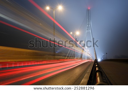 Suspension bridge in the fog and speed lines. Bridge Swietokrzyski