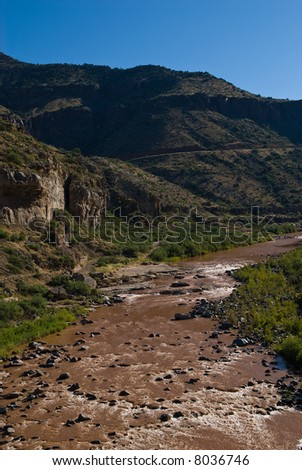 Vertical photograph of the Salt River flowing through the Salt River Canyon in Arizona.