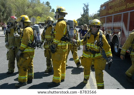Group of firefighters prepare to respond to an emergency.
