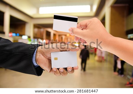 hand holding a blank smart card on blur background