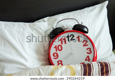 alarm clock sleeping in bed