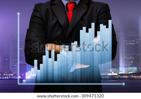 business man action on business graph virtual screen