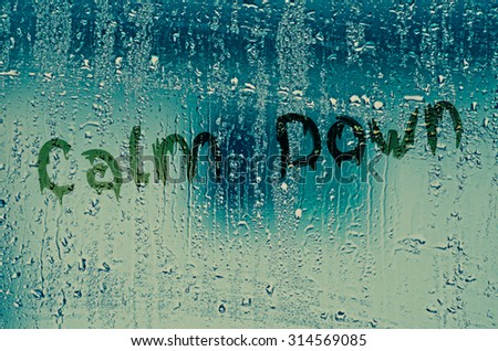natural water drops on glass window with the text 