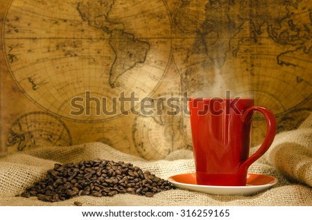 red coffee cup with smoke and coffee beans around