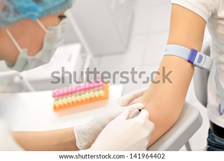 nurse preparing to make  an injection for blood taking. Medical test