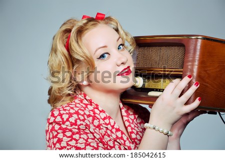 pin up plus size blonde girl posing with old fashioned radio