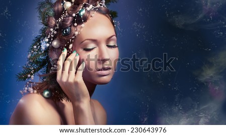 Christmas beauty woman.Holiday make up . False eyelashes,art christmas adornment. Copy space for your text