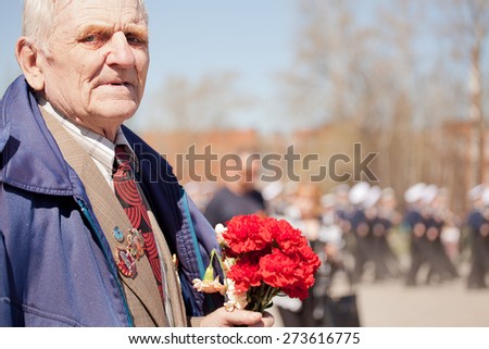 Saint Petersburg /RUSSIA - MAY 9: Old   veterans of  WWII  ,  young boy and sailor   during festivities devoted to anniversary of Victory Day on May 9, 2013 in Saint- Petersburg. Three generations