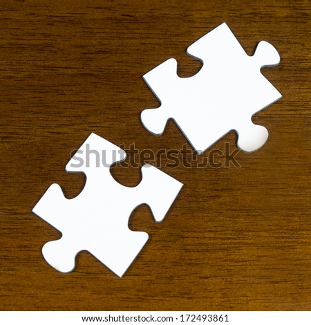 puzzle pieces on wood table
