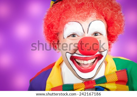 clown closeup with violet background