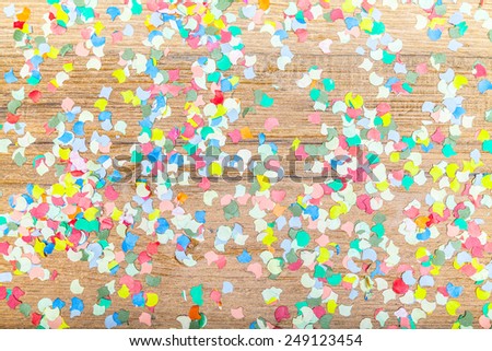 confetti background on wooden plate