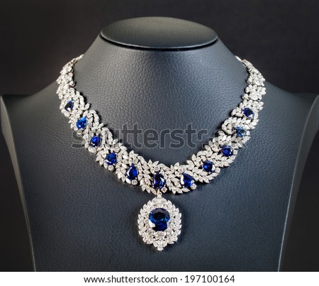 diamonds with dark blue sapphire necklace on the black background