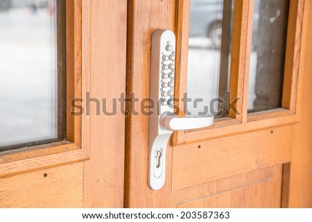 Digital handle on wooden door