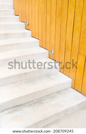 Cement stairs with wooden background