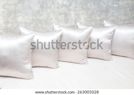 White pillows on sofa close up