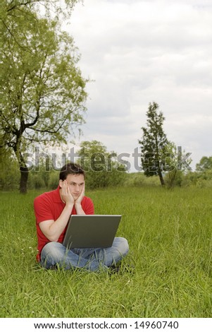 man working on laptop outdoor