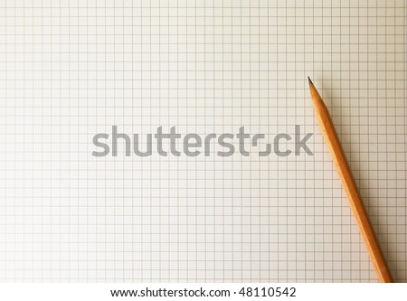 Drafting paper or graph paper with pencil under warm incandescent lighting