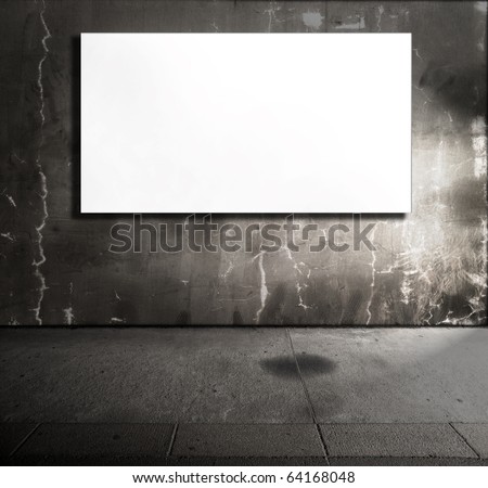 Dim stone room with white screen board.