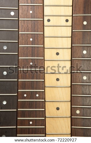 Guitar necks aligned, Rosewood, maple and ebony fingerboard necks