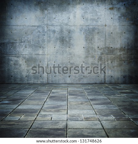Grunge concrete room with tiled concrete floor