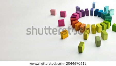Gathering, centralization, of data and people, concept image.
Circle of colorful wooden blocks representing unity of diverse elements. Isolated on neutral white.
