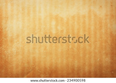 Retro wall paper texture. Amber colored wall paper with stripes and stain.