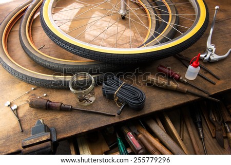 Bicycle repair. Repairing or changing a tire, tire tubes and brakes wires of an vintage bicycle.