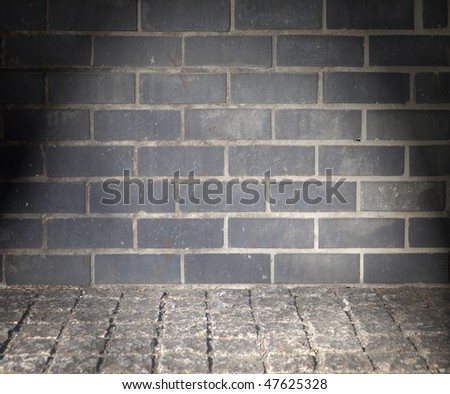 Grungy furnice like wall and floor with black brick and cobble stone. Imagine de stoc © 
