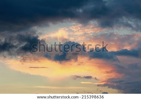 beautiful sunset sky with grey clouds and orange lighting