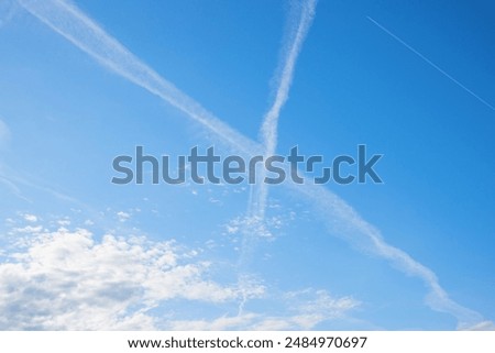 Similar – Image, Stock Photo Crossing contrails in the sky