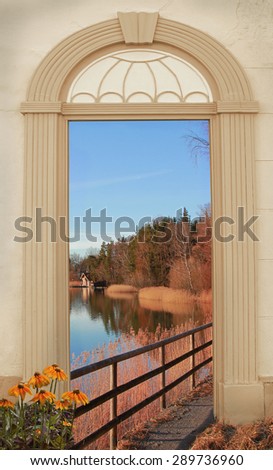 view through arched door, autumnal lakeside path