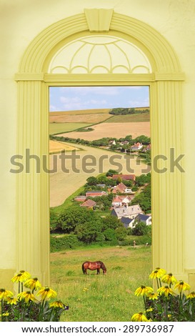 view through arched door, hilly landscape and grazing horse