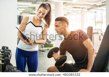 Similar – Image, Stock Photo Fitness woman consulting her training on her smartphone sitting in a jump box in the gym