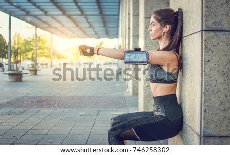 Similar – Image, Stock Photo Sportswoman leaning on wall on street and looking at camera