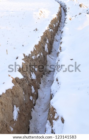 Dry ditch rural area, in the winter the snow queen