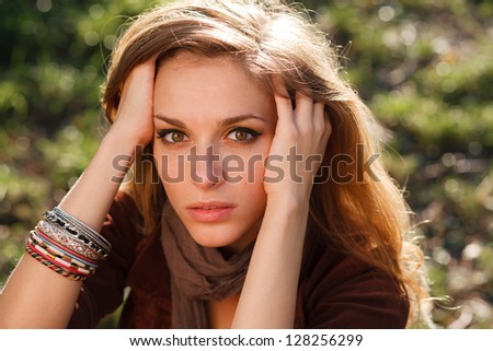 sad girl hands in hair closeup