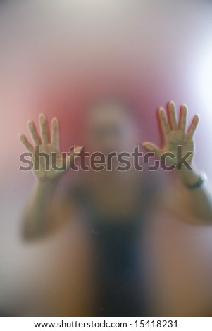 A woman pushing a glass door to open