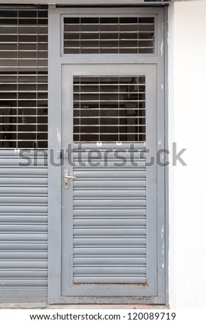 old metal swing door with half ventilation void