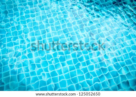pool with blue ceramic tiles and water ripple effect