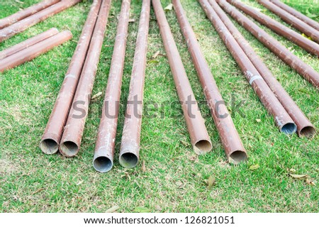 steel tube on a green grass
