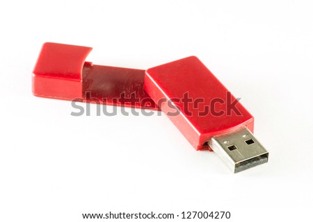 Red USB memory stick on white