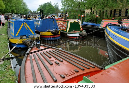 RICKMANSWORTH, HERTFORDSHIRE, UK - MAY 18. Narrow boats mooring along the Grand Union Canal on May 18, 2013 for the town festival at Rickmansworth, Hertfordshire, England, UK.
