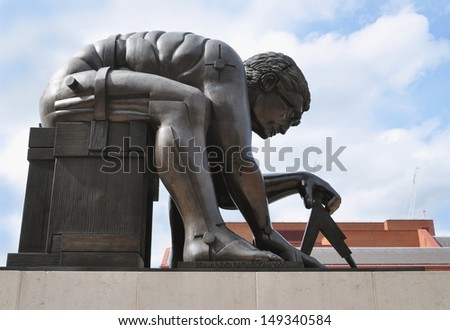 LONDON - AUGUST 4. \'Newton\' is a 1995 bronze sculpture by Eduardo Paolozzi, after a painting of Issac Newton by William Blake, located on the British Library concourse on August 4, 2013 in London, UK.