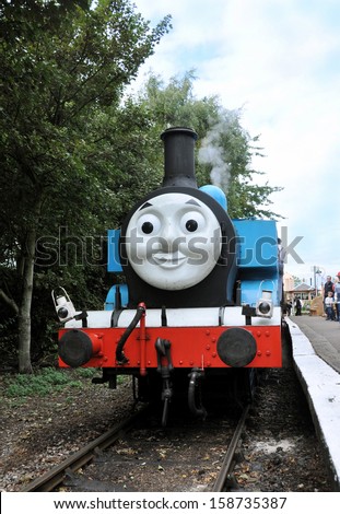 DIDCOT, UK - OCTOBER 5. Thomas the Tank Engine is a live steam engine, based on books by Reverend Wilbert Awdry, arriving at the station on October 5, 2013 at Didcot Railway Centre, Oxfordshire, UK.