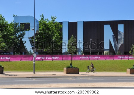 LONDON - JULY 3. Monica Bonvicini\'s 29.5 feet (9 metre) art installation of reflective letters RUN on July 3, 2014 by the Copper Box Arena  in the Queen Elizabeth Olympic Park, Stratford, London.