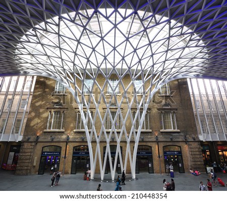 LONDON - AUGUST 2. King's Cross railway station western departures concourse diagrid roof structure on August 2, 2014, designed by John McAsian and built by Vinci; located in London, UK.